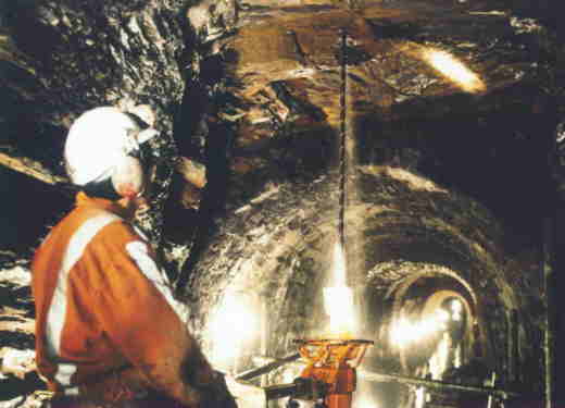 Drilling holes for the rock bolts. Photo: British Waterways