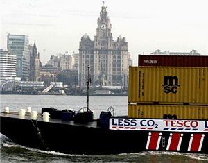 One of the new barges passing Liverpool's waterfront.